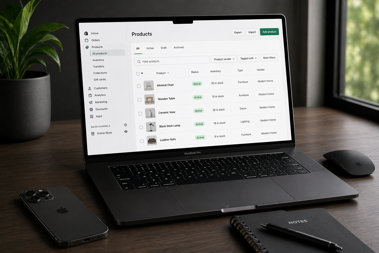 macbook pro with iphone and magic mouse displaying shopify product listing page