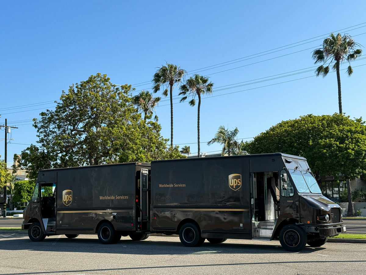 delivery ups trucks back to back